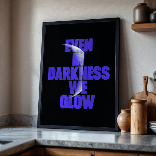 Even In Darkness We Glow print displayed in frame - space typography wall art